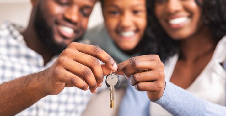 happy-african-american-family-holding-keys-from-th-2021-08-30-02-27-11-utc.jpg